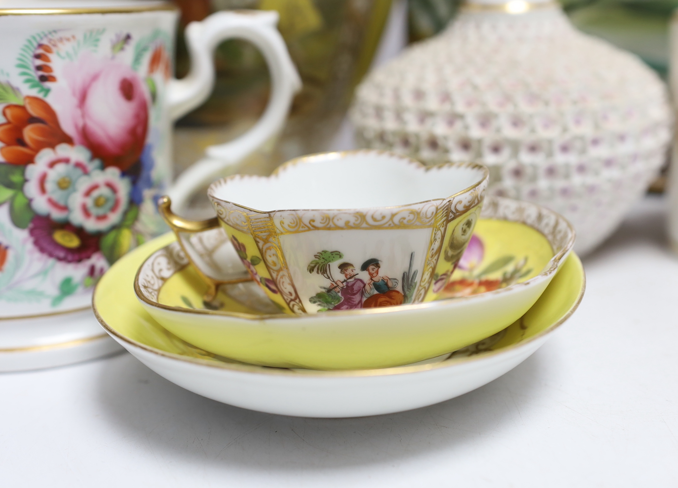 A Dresden jar and cover and similar cup and saucer, a large floral vase, two floral mugs, a floral encrusted bottle and stopper and two other items, largest 28cm high (8)